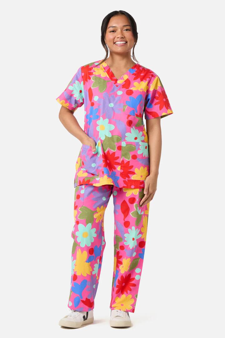 Image of a model wearing Uniforms & Workwear. Product name - Rose Scrub Set in Pink colour by brand - Gorman