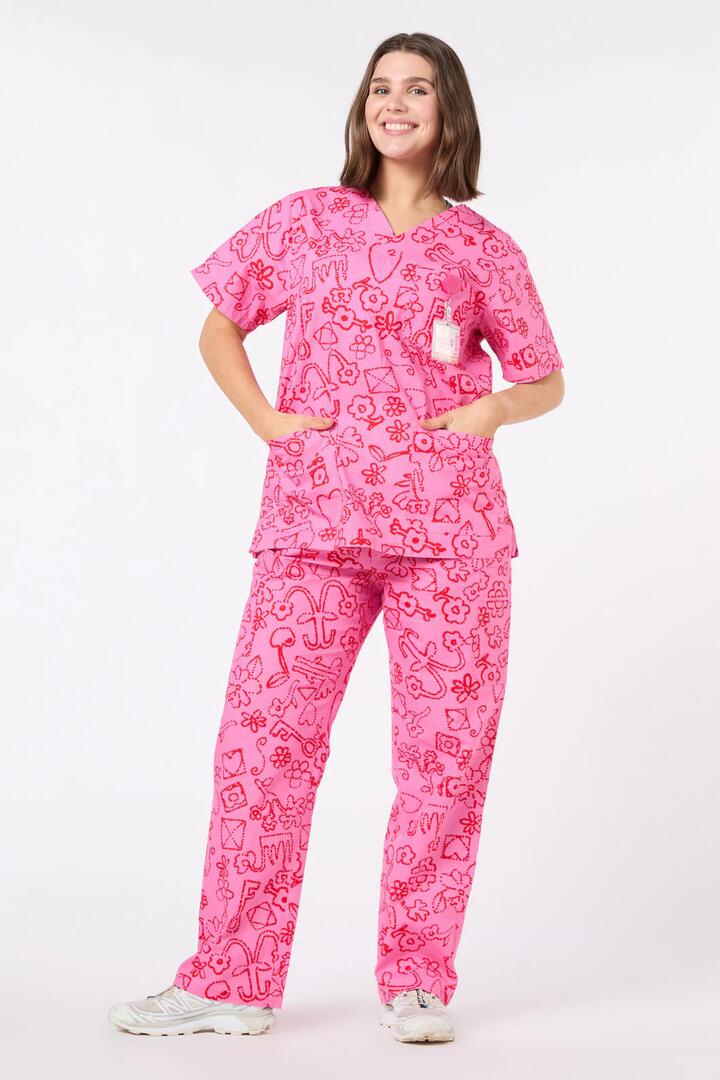 Image of a model wearing Uniforms & Workwear. Product name - Love Letter Scrub Set in Pink colour by brand - Gorman