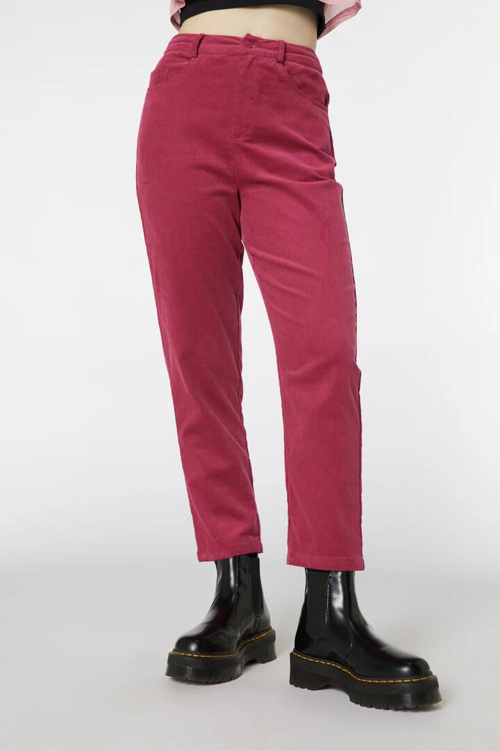 Image of a model wearing Pants. Product name - Bitchin Pant in Pink colour by brand - Revival
