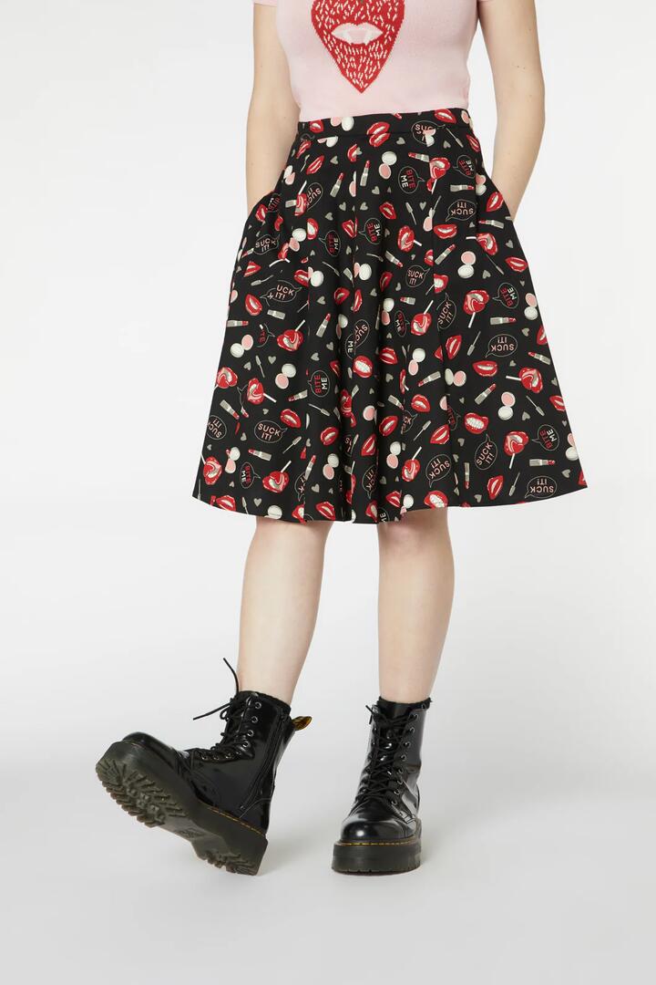 Image of a model wearing Skirts. Product name - Kiss And Makeup Skirt in Pink colour by brand - Revival