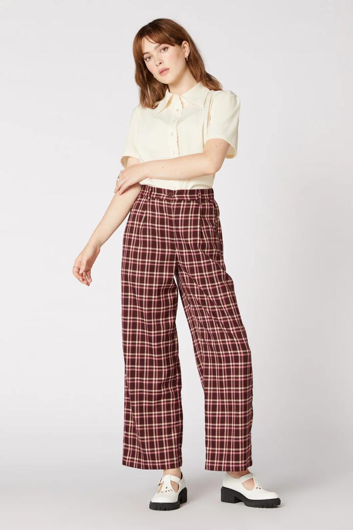Image of a model wearing Pants. Product name - Gina Check Pant in Teal colour by brand - Princess Highway