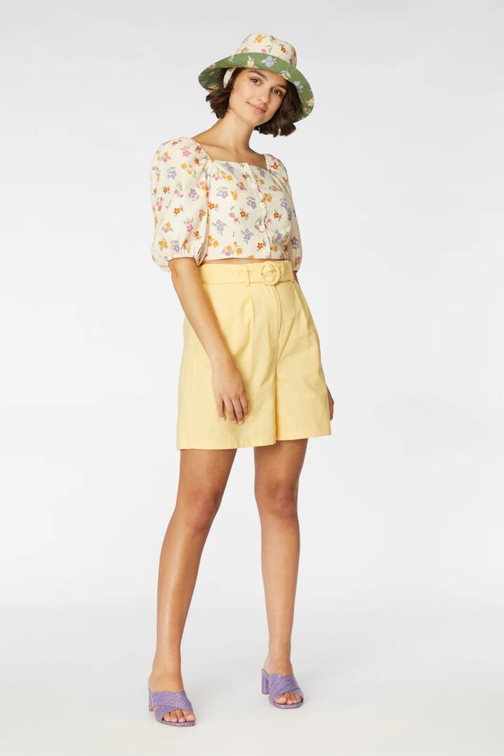 Image of a model wearing Shorts. Productname: Magnolia Shorts in Lemon colour by brand - Princess Highway