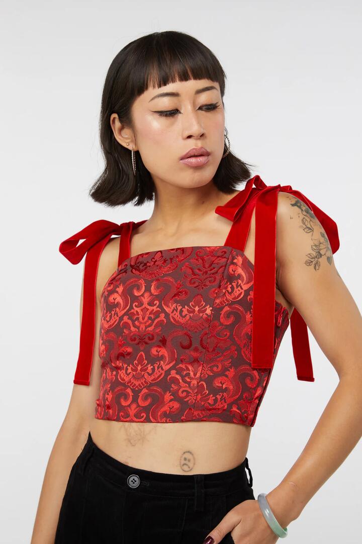 Image of a model wearing Tops. Productname: Queenie Top in Red colour by brand - Dangerfield