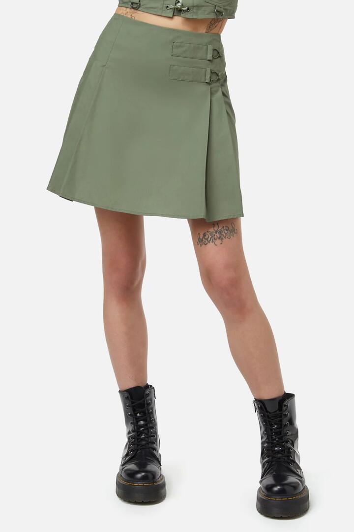 Image of a model wearing Skirts. Productname: Field Work Pleated Skirt in Olive colour by brand - Dangerfield