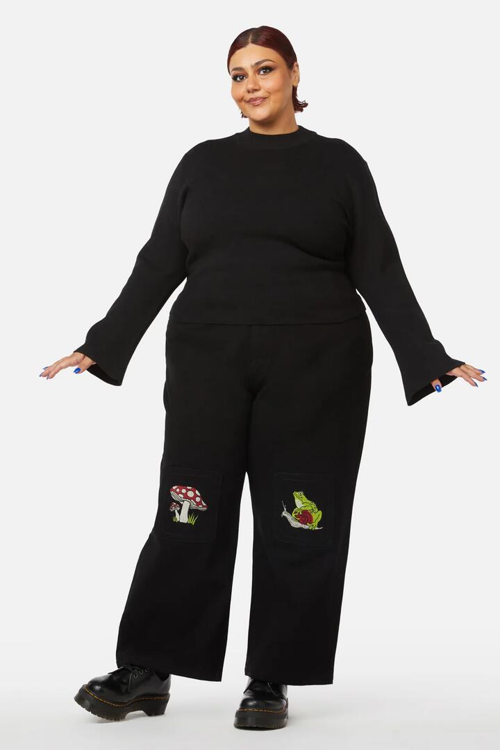 Image of a model wearing Tops. Product name - Curve Night Cat Knit in Green colour by brand - Black Friday