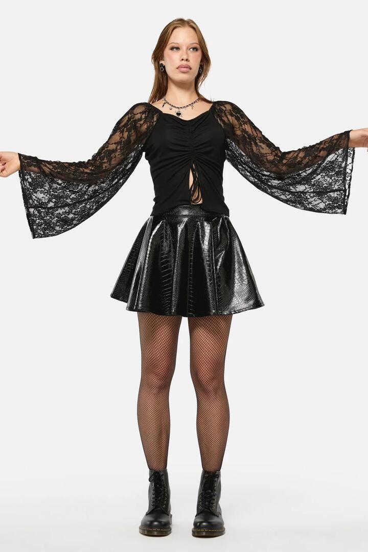 Image of a model wearing Skirts. Product name - Scales PU Circle Skirt in Black colour by brand - Black Friday