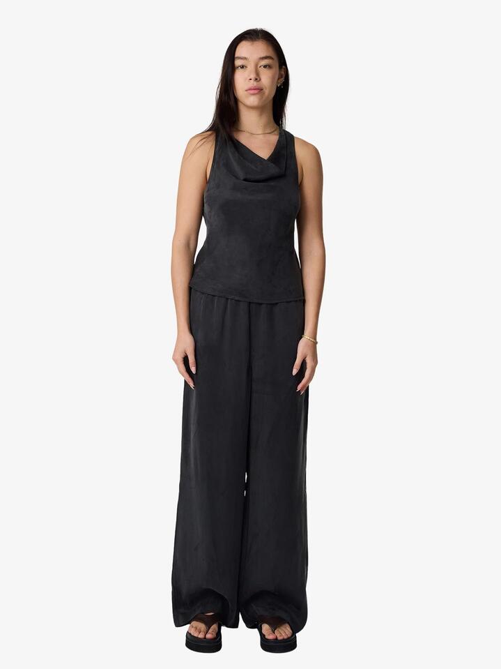 Image of a model wearing Pants. Productname: MSE Cupro Pants in Black colour by brand - MSE