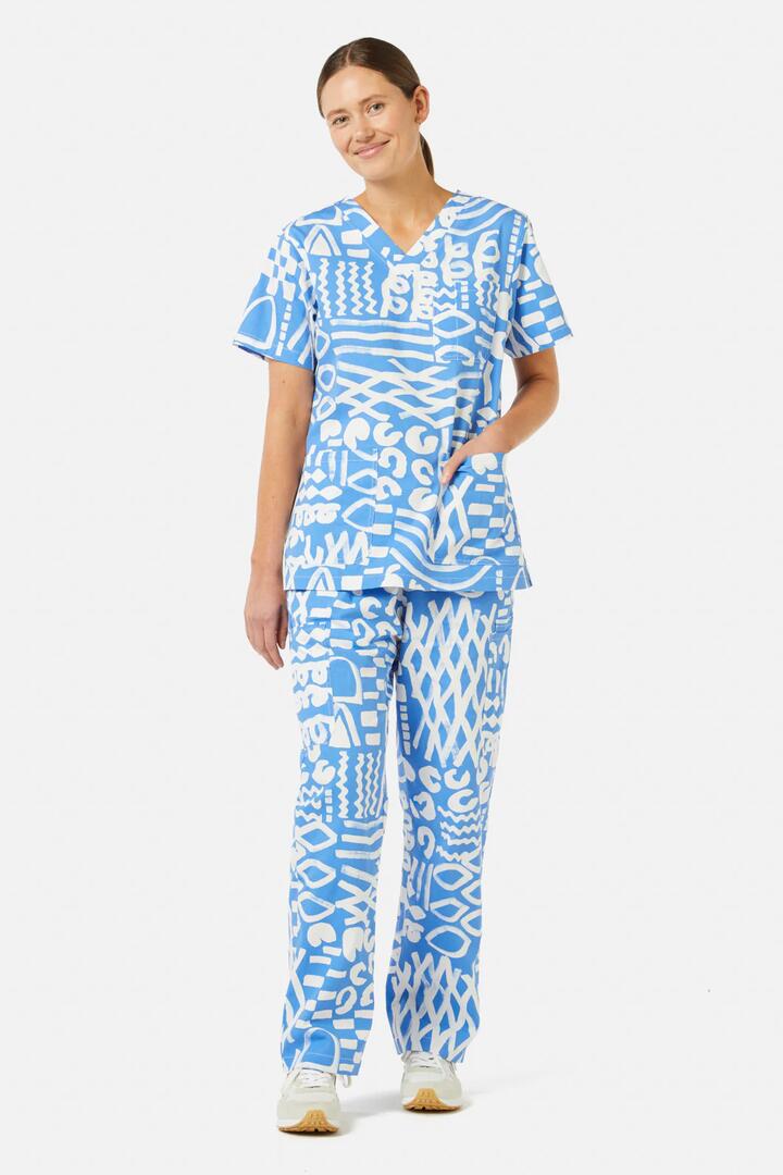 Image of a model wearing Uniforms & Workwear. Product name - Take Time Scrub Set in Print colour by brand - Gorman