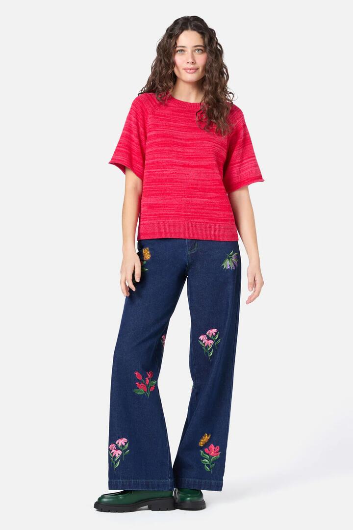 Image of a model wearing Shorts. Productname: Fern Short Sleeve Knit Top in Red colour by brand - Princess Highway