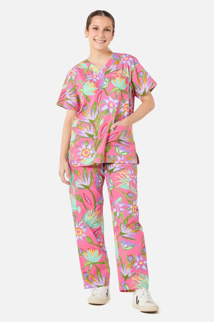 Image of a model wearing Uniforms & Workwear. Product name - Lotus Flower scrub set in Pink colour by brand - Gorman