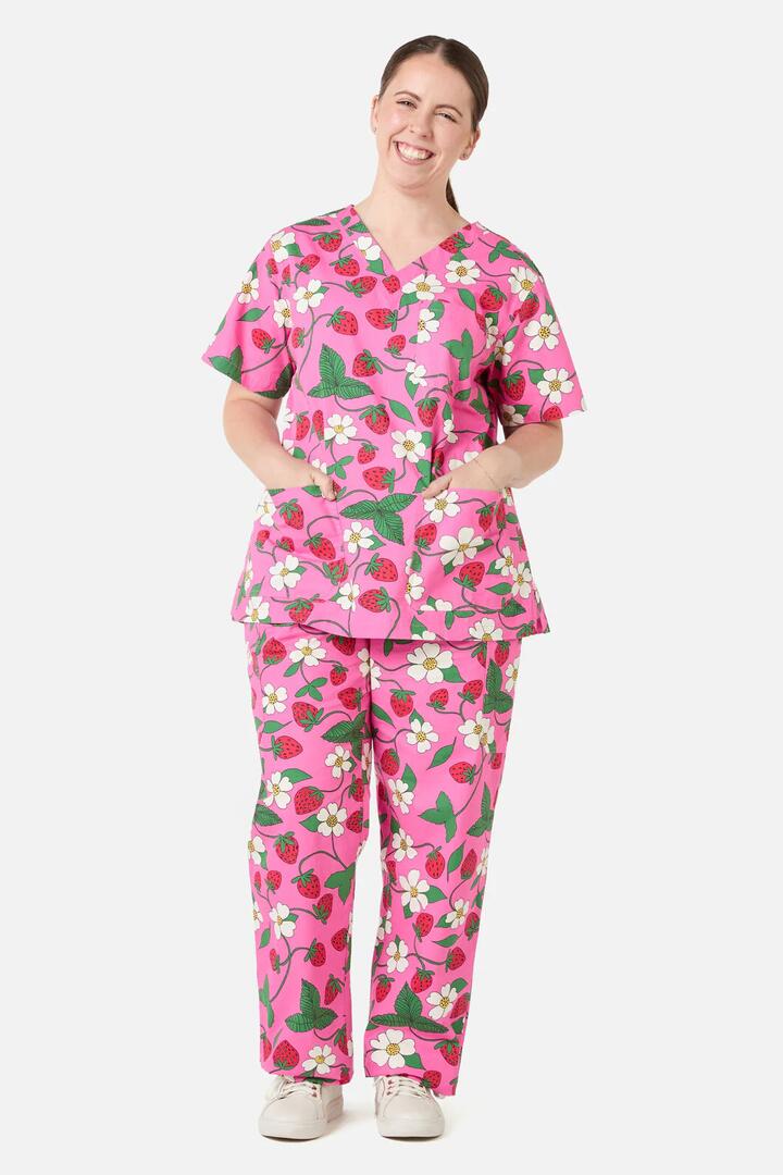 Image of a model wearing Uniforms & Workwear. Productname: Berry Cute scrub set in Pink colour by brand - Scrubs With Love