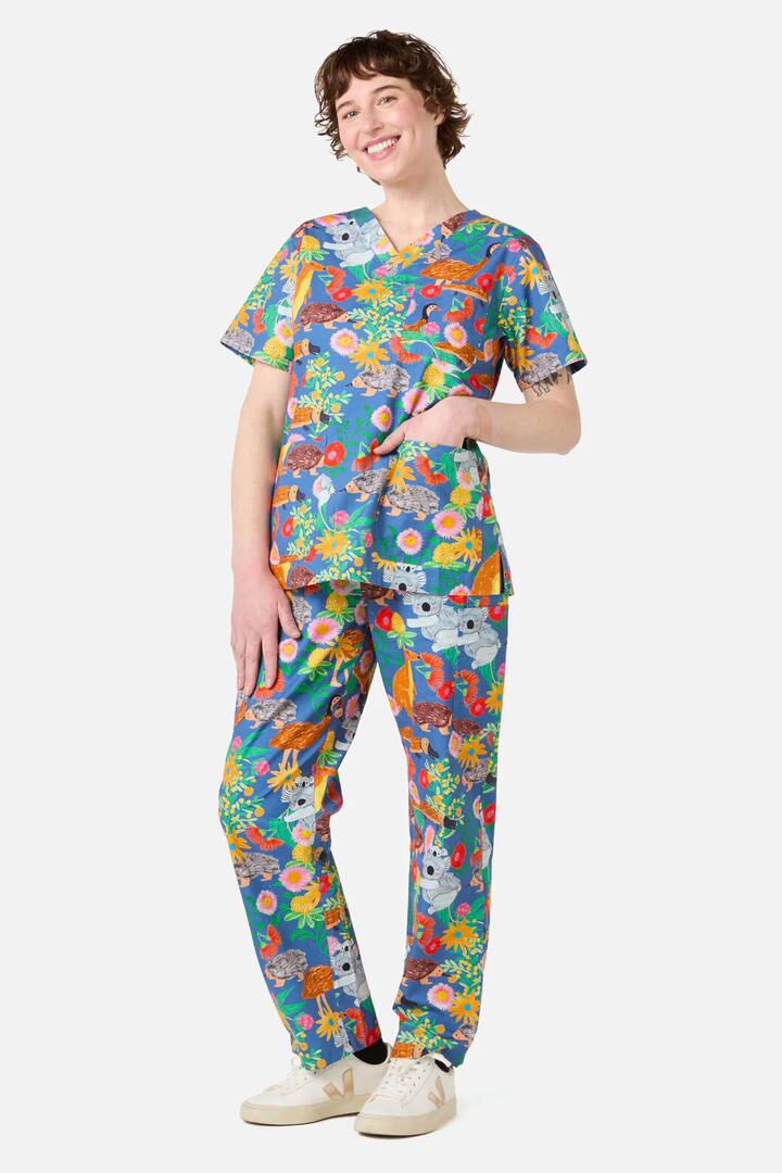 Image of a model wearing Uniforms & Workwear. Productname: Bush Tapestry scrub set in Blue colour by brand - Scrubs With Love