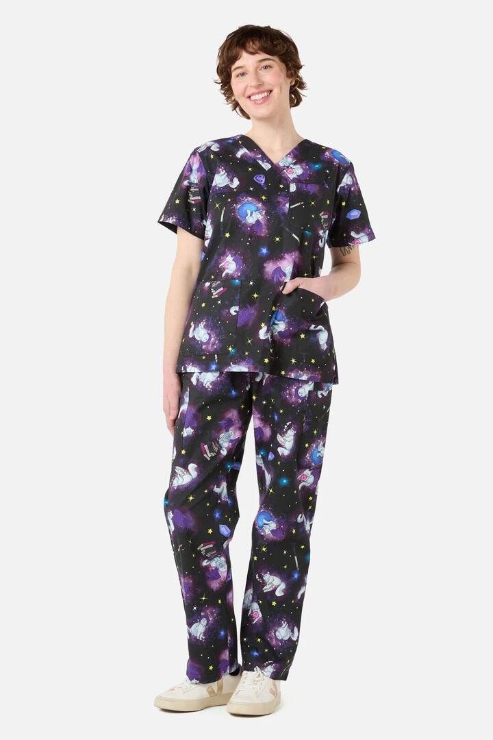 Image of a model wearing Uniforms & Workwear. Productname: Magic Cats scrub set in Purple colour by brand - Scrubs With Love