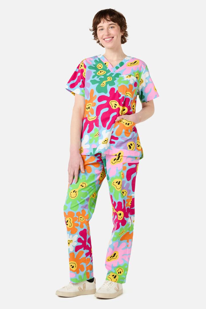 Image of a model wearing Uniforms & Workwear. Productname: Flower Flow scrub set in Blue colour by brand - Scrubs With Love