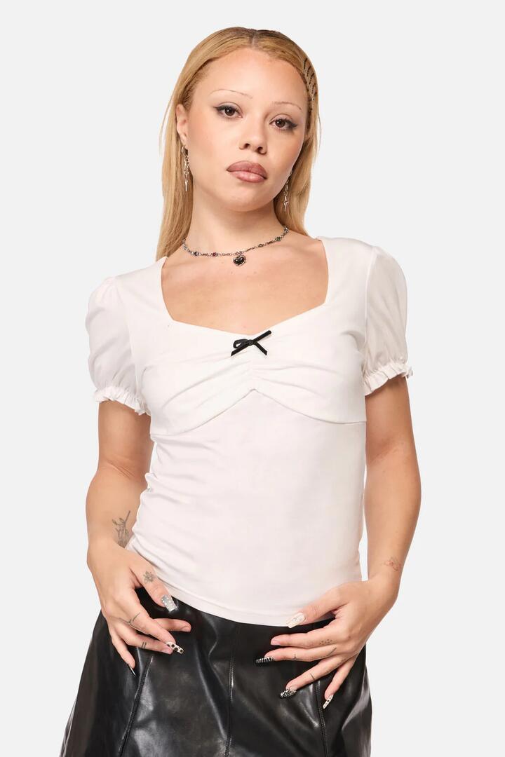 Image of a model wearing Tops. Productname: Witches Familiar Top in Cream colour by brand - Black Friday