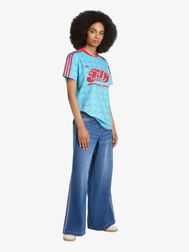 Image of a model wearing Tops. Productname: Adidas Graphic Football Allover Print Jersey in Blue Glow colour by brand - Adidas