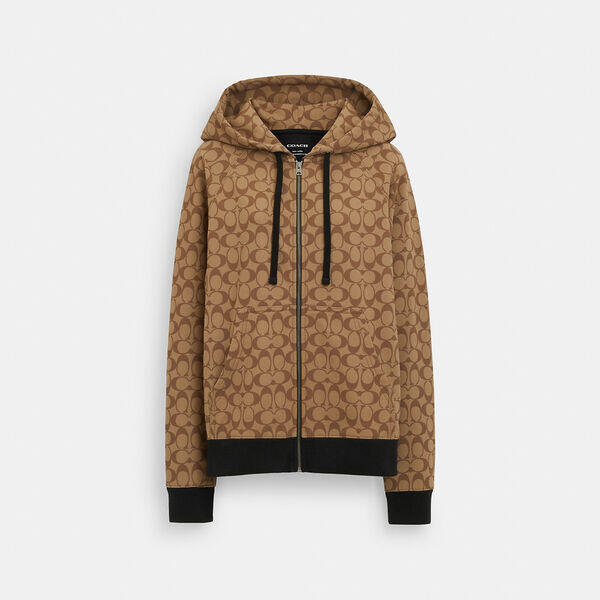 Image of a model wearing Outerwear. Productname: All Over Signature Zip Hoodie in KHAKI MULTI colour by brand - Coach Outlet Australia