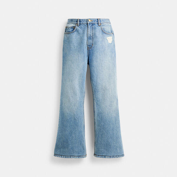 Image of a model wearing Denim. Productname: Denim Bootcut Jeans in Denim Blue colour by brand - Coach Outlet Australia