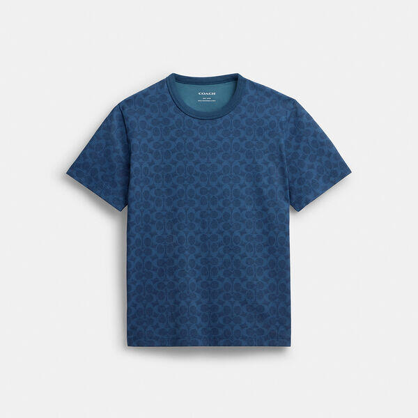 Image of a model wearing Tops. Productname: All Over Signature T-Shirt In Organic Cotton in NAVY MULTI colour by brand - Coach Outlet Australia