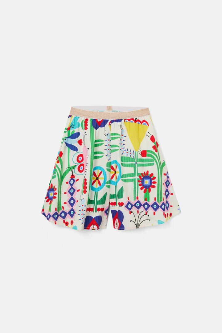 Image of a model wearing Shorts. Product name - Mini Hideout Kids Shorts in Cream colour by brand - Gorman