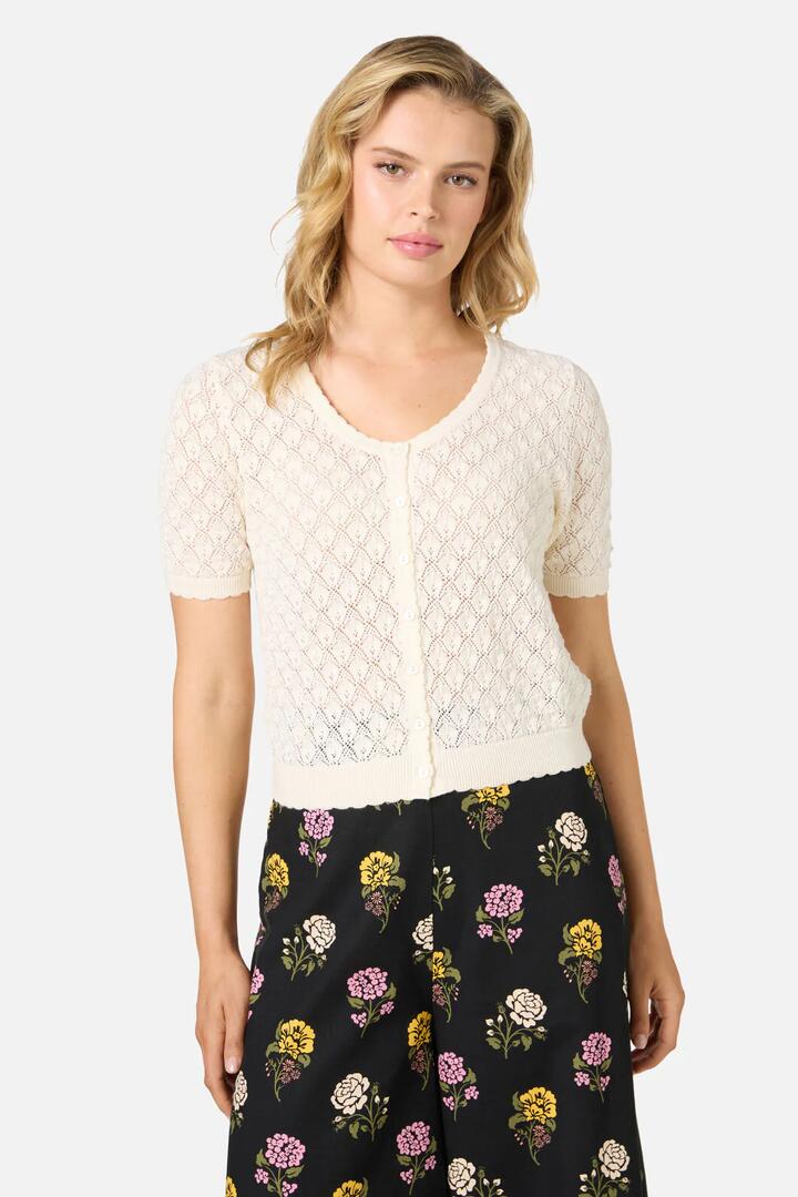 Image of a model wearing Tops. Product name - Lacey Short Sleeve Cardigan in Cream colour by brand - Princess Highway