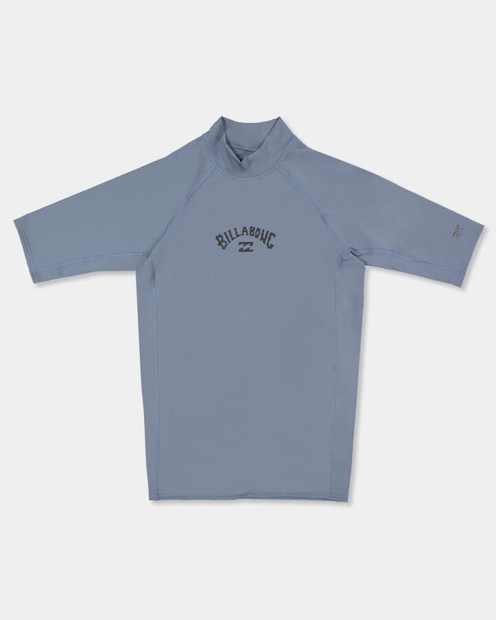 Image of a model wearing Tops. Product name - Billabong Mens All Day Arch Short Sleeve Rash Vest Steel Blue in Steel Blue colour by brand - Billabong