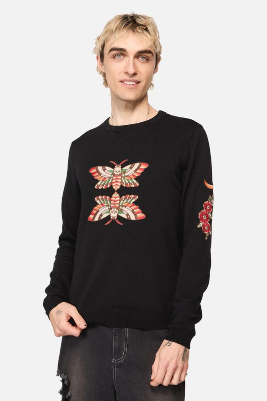 Image of a model wearing Outerwear. Productname: All Hallows Eve Tattoo Knit Jumper in Black colour by brand - Dangerfield