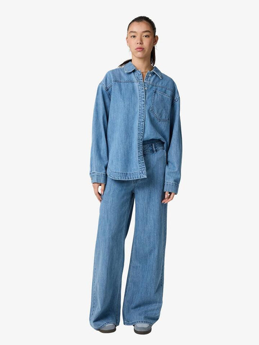 Image of a model wearing Denim. Productname: Lulu & Rose Bria Denim Shirt in Light Blue colour by brand - Lulu & Rose