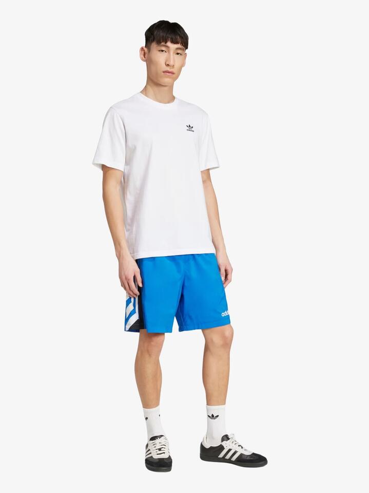Image of a model wearing Shorts. Productname: Adidas 90s Soccer Shorts in Blue colour by brand - Adidas