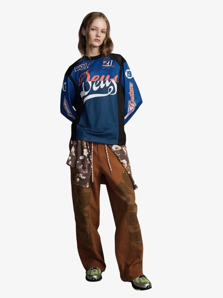 Image of a model wearing Tops. Productname: Deus Moss Gather Moto in Blue Light colour by brand - Deus
