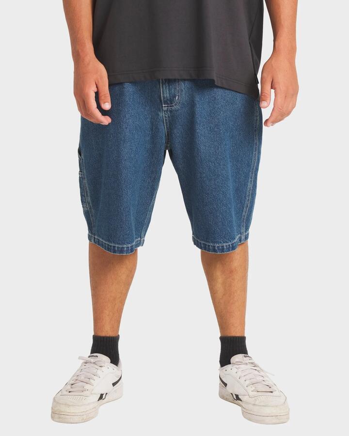 Image of a model wearing Shorts. Product name - Billabong Mens Spec 73 Bad Dog Walkshorts Ocean Wash in Ocean Wash colour by brand - Billabong