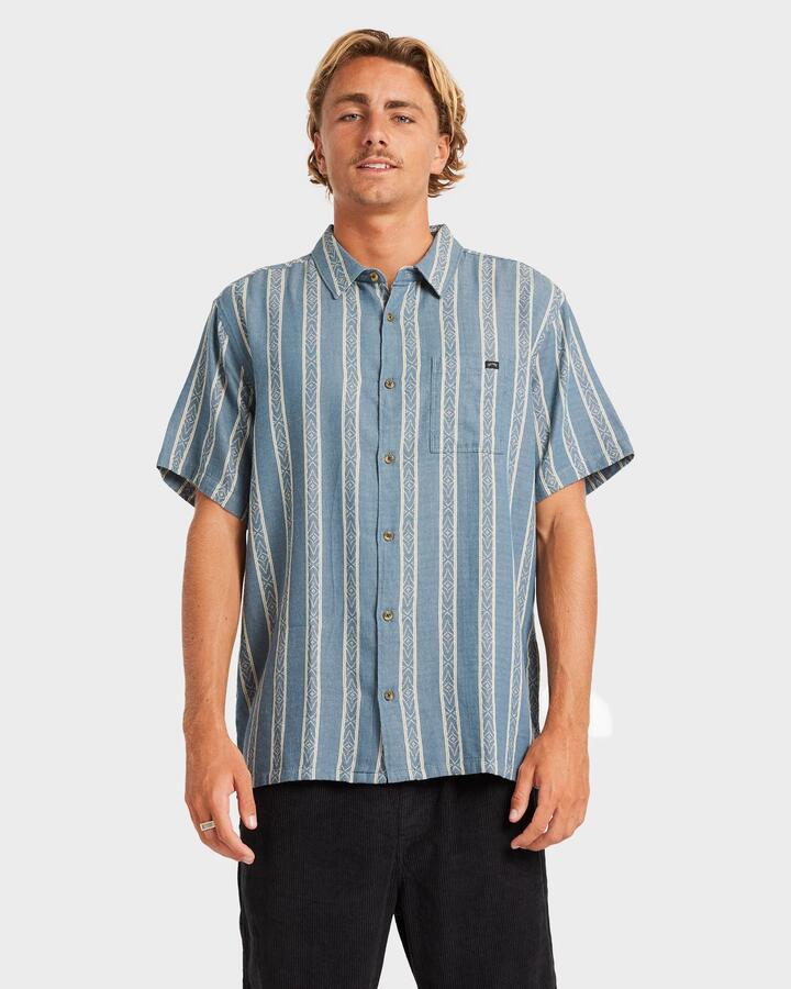 Image of a model wearing Tops. Product name - Billabong Mens Sundays Jacquard Short Sleeve Shirt Real Teal in Real Teal colour by brand - Billabong
