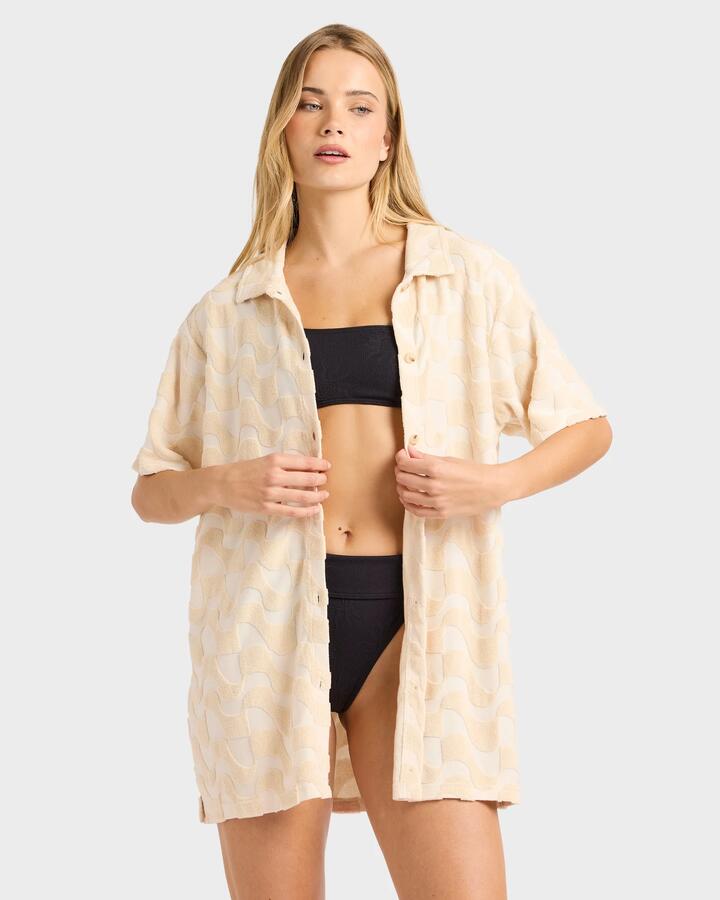 Image of a model wearing Tops. Productname: Billabong - Womens Laura Waves Long Sleeve Shirt - Antique White - in Antique White colour by brand - Billabong