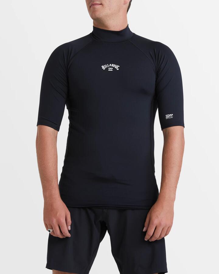 Image of a model wearing Tops. Product name - Billabong Mens All Day Arch Short Sleeve Rash Vest Black in Black colour by brand - Billabong