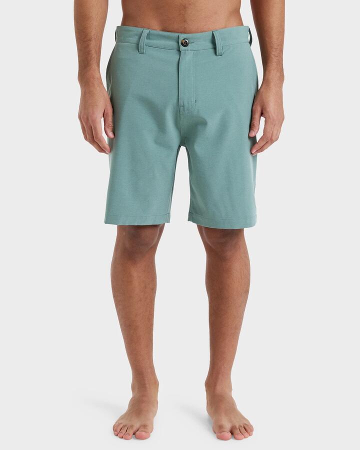 Image of a model wearing Shorts. Product name - Quiksilver Mens Union Heather 19" Hybrid Shorts Sea Spray in Sea Spray colour by brand - Quiksilver