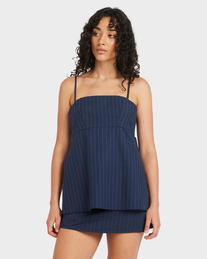 Image of a model wearing Outerwear. Productname: RVCA - Womens Maeve Tunic Tank Top - Starry Night - in Starry Night colour by brand - RVCA