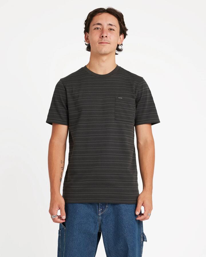 Image of a model wearing Tops. Product name - Volcom Mens Dorture Crew Short Sleeve Shirt Stealth in Stealth colour by brand - Volcom