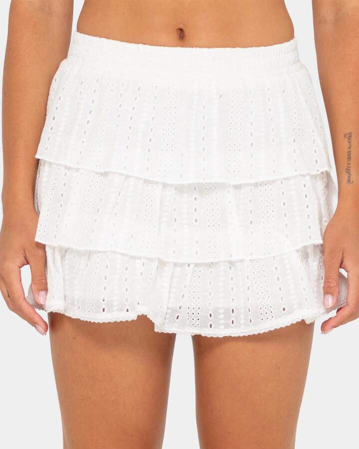 Image of a model wearing Skirts. Productname: Rusty Womens Ra Ra Rusty Low Rise Mini Skirt White - in White colour by brand - Rusty