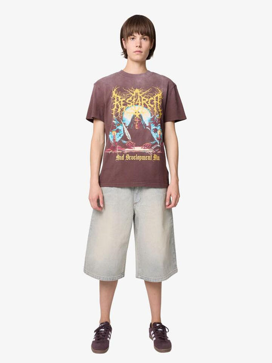 Image of a model wearing Tops. Productname: Deus R&D Tee in Chocolate Brown colour by brand - Deus