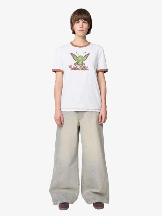 Image of a model wearing Tops. Productname: Deus Extraordinary Places Ringer Tee in Vintage White colour by brand - Deus