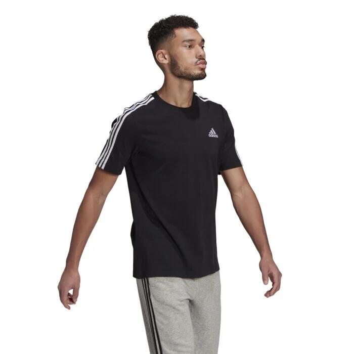 Image of a model wearing Tops. Productname: Adidas Essentials Men's 3 Stripes T-shirt in Black colour by brand - ADIDAS