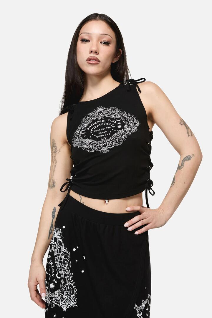 Image of a model wearing Tops. Product name - Séance Goth Print Tank Top in Black colour by brand - Dangerfield