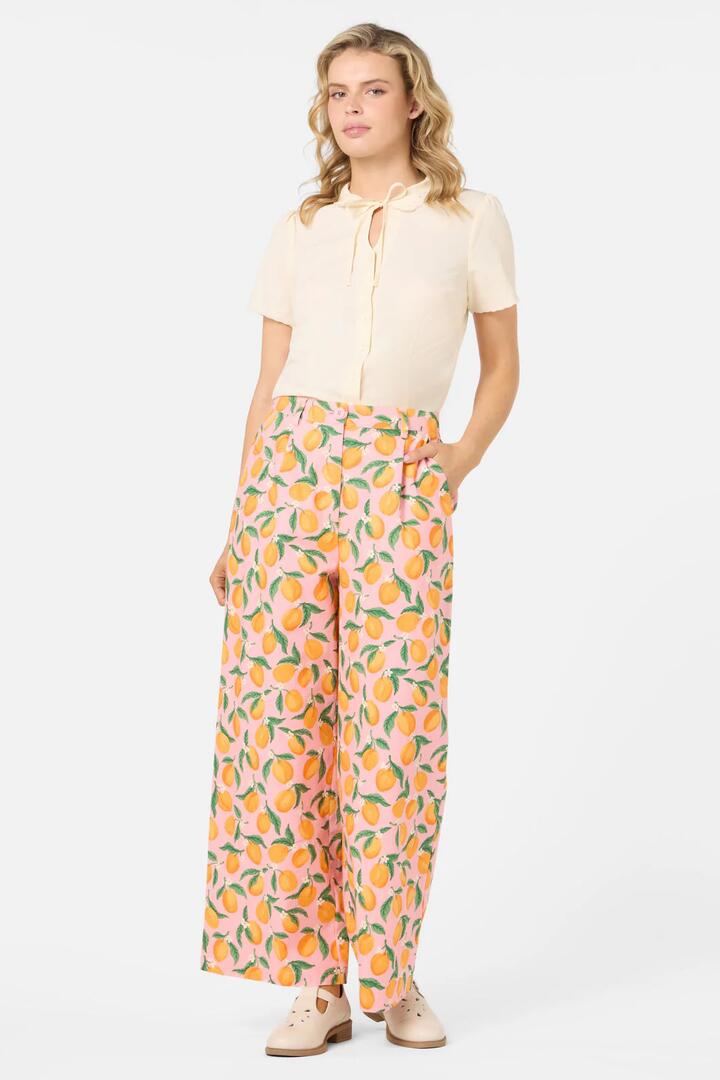 Image of a model wearing Pants. Product name - Apricots Relaxed Pant in Pink colour by brand - Princess Highway