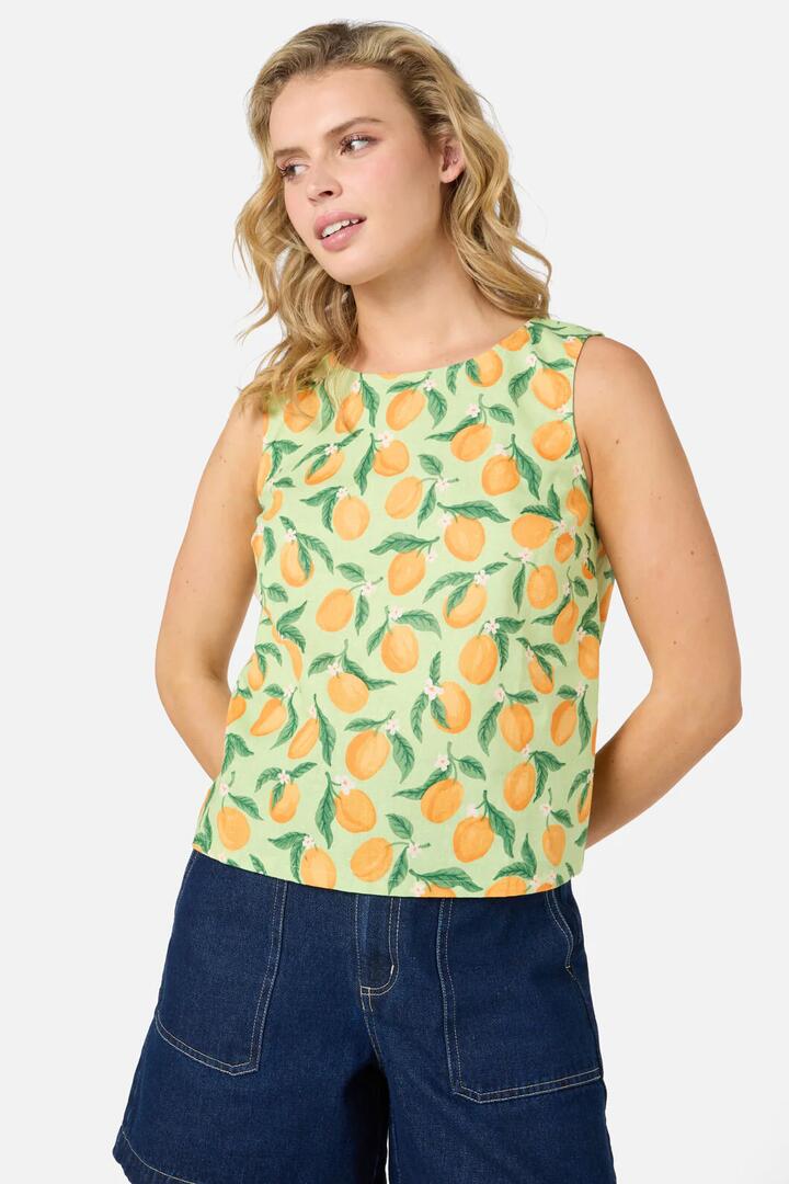 Image of a model wearing Tops. Product name - Apricots Shell Top in Green colour by brand - Princess Highway