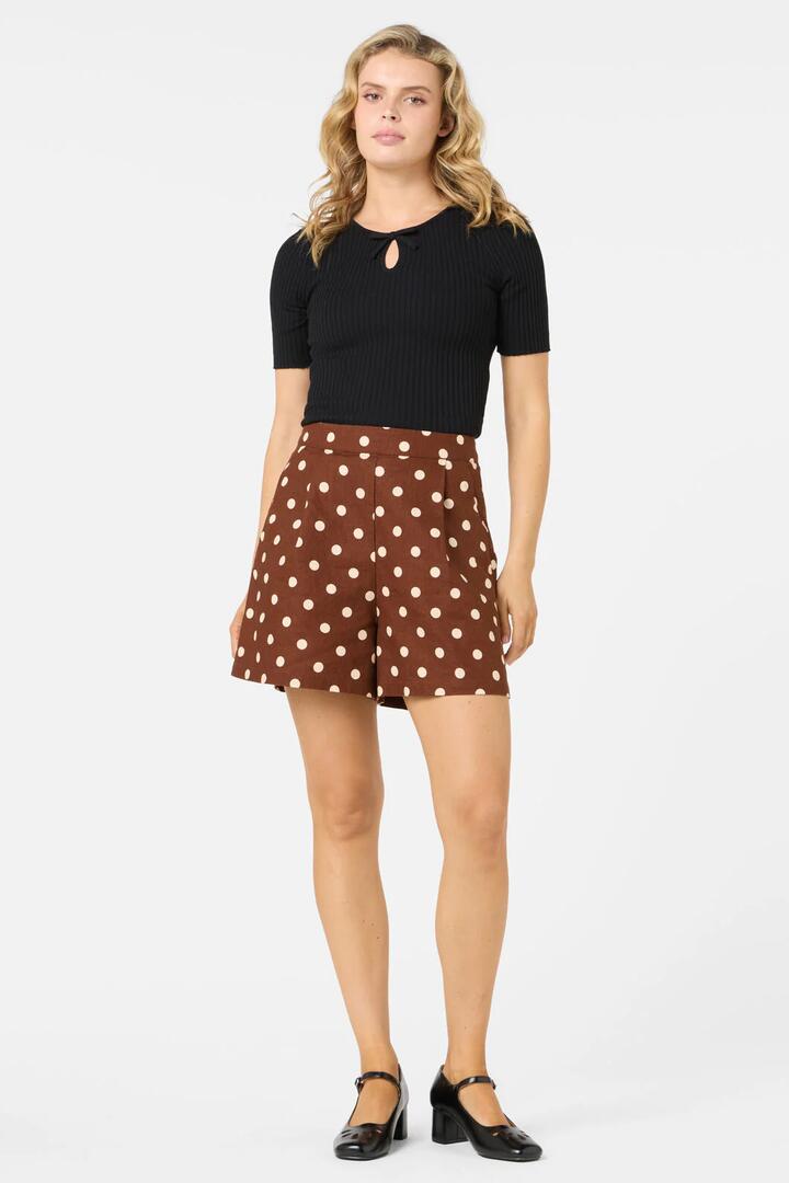 Image of a model wearing Shorts. Product name - Polka Dot A Line Shorts in Chocolate colour by brand - Princess Highway