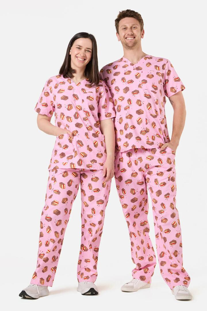 Image of a model wearing Uniforms & Workwear. Product name - Lamington Scrub Set in Pink colour by brand - Scrubs With Love