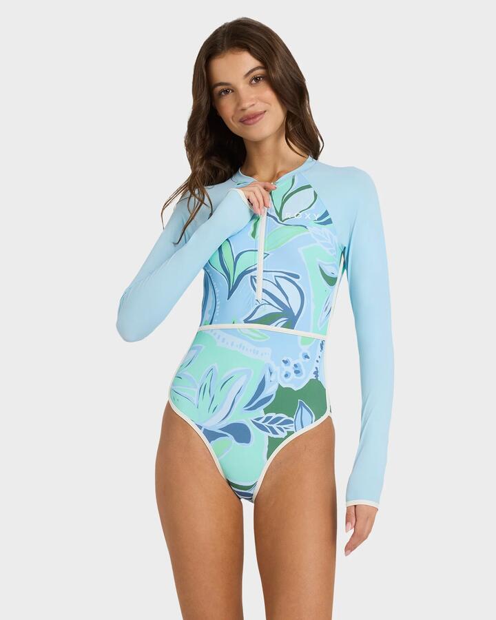 Image of a model wearing Tops. Product name - Roxy Womens Botanic Active Long Sleeve One Piece Rash Vest Airy Blue in Airy Blue colour by brand - Roxy