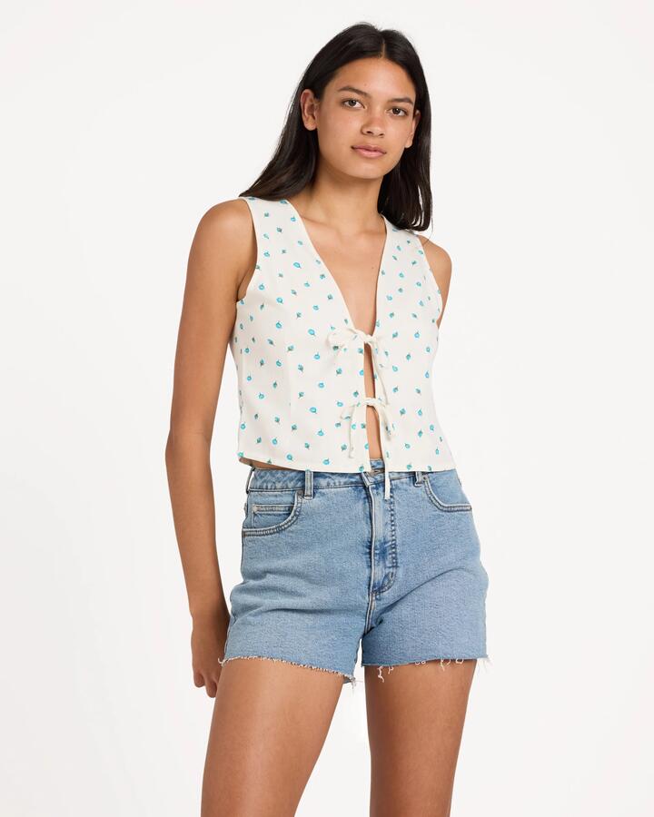 Image of a model wearing Tops. Productname: RVCA Womens Rose Bud Cami Top White - in White colour by brand - RVCA