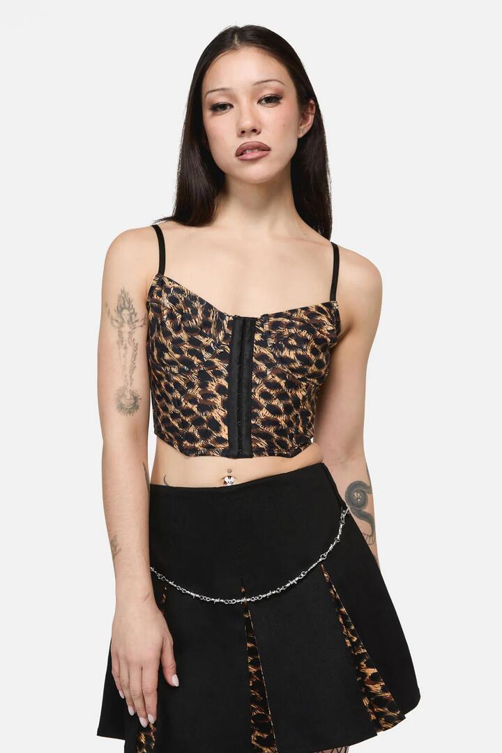 Image of a model wearing Tops. Product name - Leopard Print Grunge Top in Brown colour by brand - Dangerfield