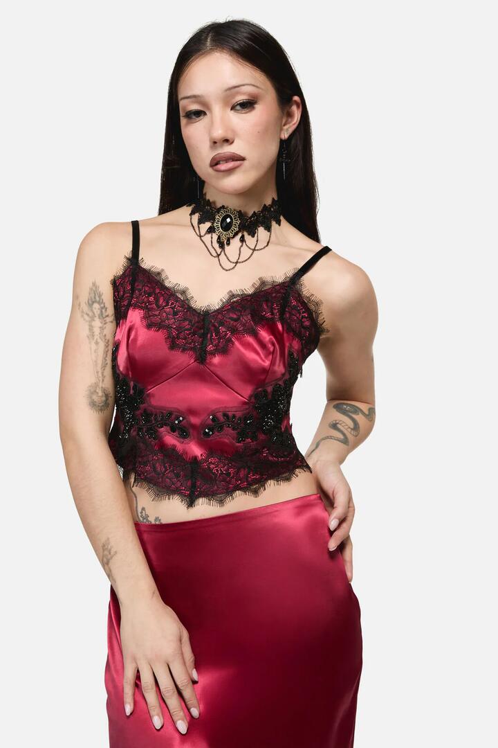 Image of a model wearing Tops. Product name - Rosalie Formal Lace Trim Top in Red colour by brand - Dangerfield